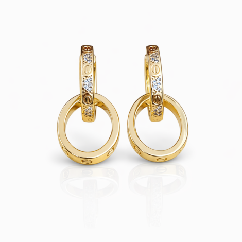 These elegant Cartier Love hoop earrings are crafted from polished yellow gold and feature the iconic Love screw motif, accented with brilliant-cut diamonds set along the front of each hoop. Designed with a hinged closure and a detachable circular drop, this refined pair blends Cartier’s signature symbolism with timeless sophistication, making them suitable for both everyday wear and special occasions.  Follow this item for alerts. Cartier is a registered trademark of Cartier. We are not affiliated with Cartier.