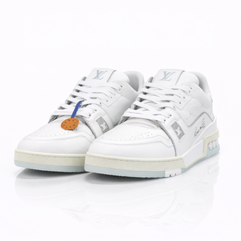 These iconic Louis Vuitton LV Trainer sneakers showcase the house’s commitment to luxury sportswear with their pristine white leather construction. Designed by Virgil Abloh, these mid-top trainers feature the signature LV monogram debossed on the tongue, intricate paneling details, and perforated leather for breathability. The sneakers include distinctive striped laces and come with branded hang tags, representing a perfect fusion of streetwear aesthetics and high-fashion craftsmanship.  Follow this item for alerts. Louis Vuitton is a registered trademark of Louis Vuitton. We are not affiliated with Louis Vuitton.  Condition: Excellent  Specifications:  Height (ankle): 4.5 in / 11.4 cm (approx)  Width: Standard Sole thickness: 1.2 in / 3 cm (approx) Closure: Lace-up Product Details:  Brand: Louis Vuitton Model/Style: LV Trainer Sneaker Color: White/Off-White Material: Calf leather Hardware: Silver-tone eyelets Designer: Virgil Abloh for Louis Vuitton Made in: Italy